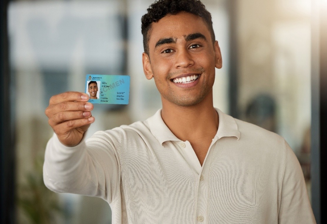 Man Holding Cayman Islands Identity Card_MyeID 2026