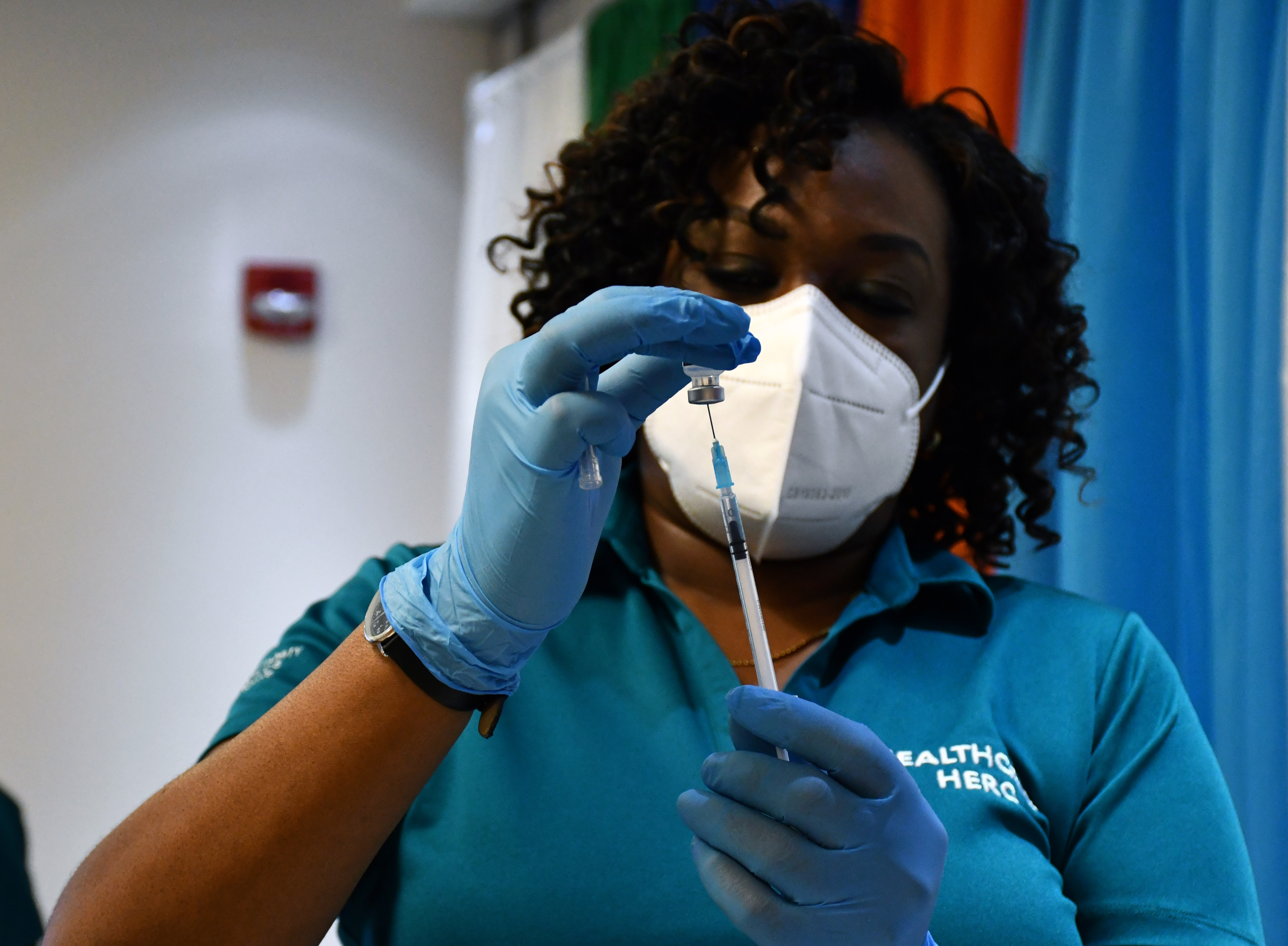 Nurse at Cayman Islands Health Services Authority prepares vaccine
