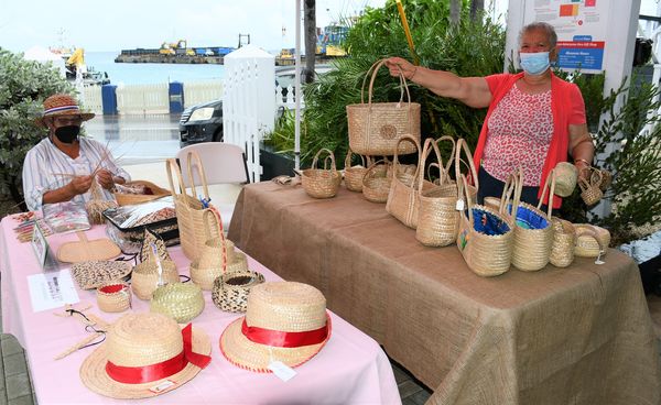 Caymanian women showcasing traditional crafts