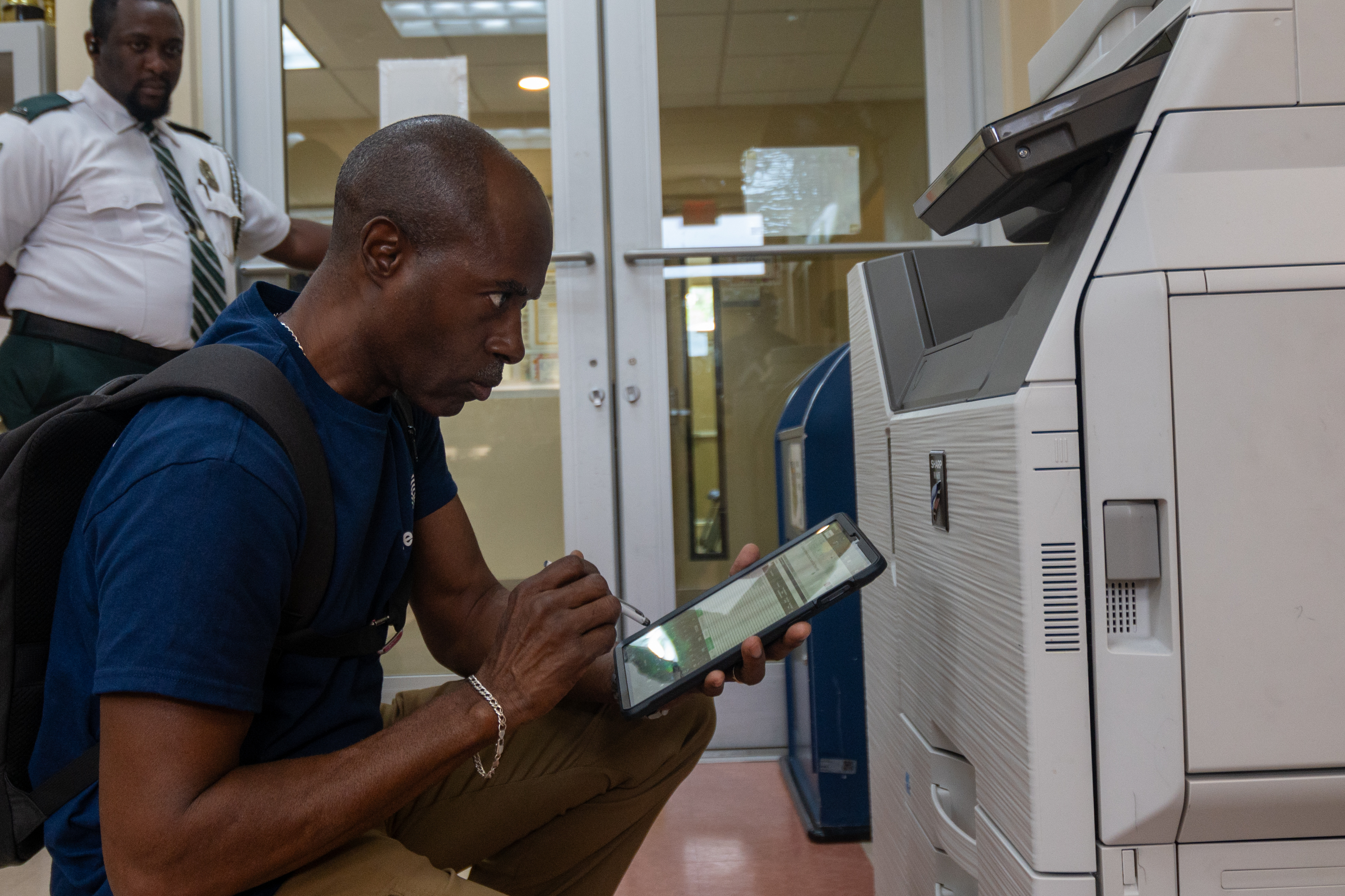 Grand Cayman Civil Servant inspects office hardware for energy deficiency