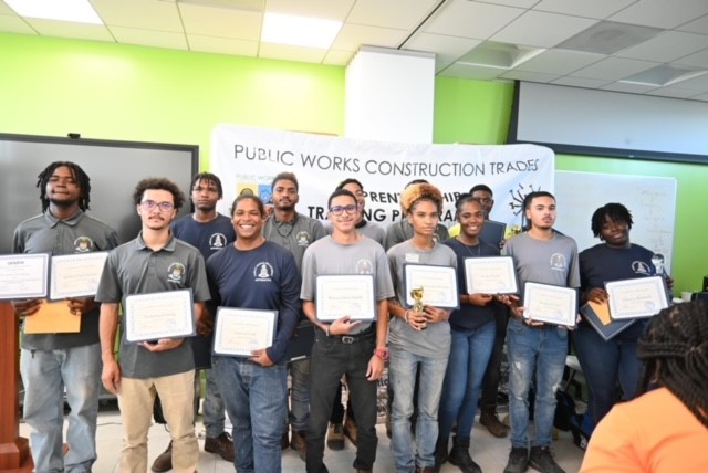Cayman Islands Public Works Department Apprenticeship class pose with their awards for completion.