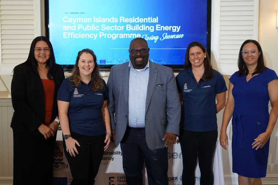 The Minister and Chief Officer of MSCRW Pose for a picture with the Energy Unit team