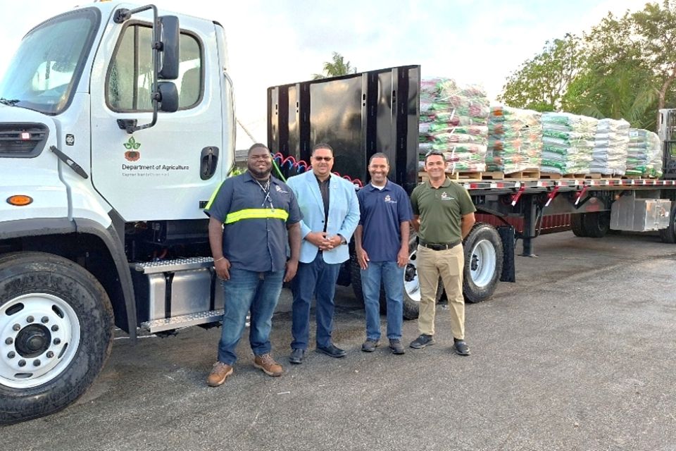 Photos from the official launch feature the Hon. Minister Johany Ebanks, MP, JP for Planning, Lands, Agriculture, Housing & Infrastructure, Department of Agriculture Director Wilbur Welcome, Commercial Centre Driver and operational staff.